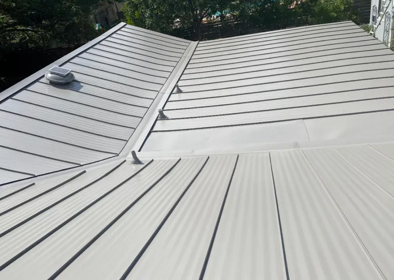 Solar attic fan installed on a metal roof for Roof Ventilation in Kennett